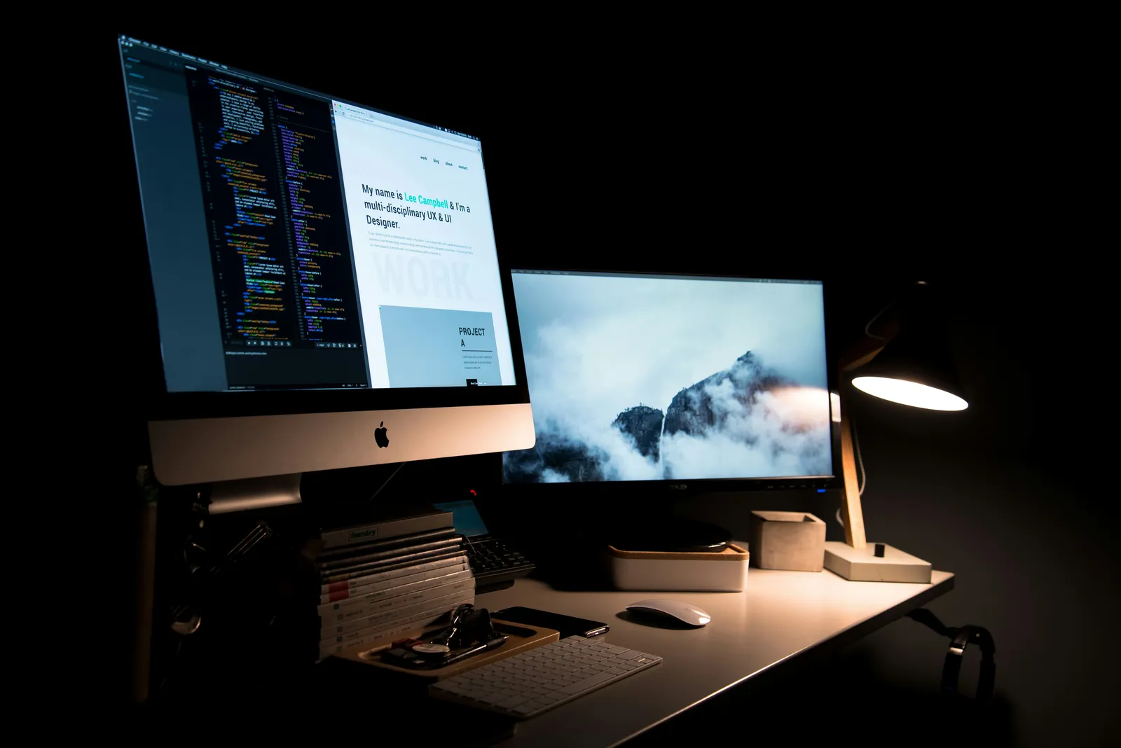 Designer sketching website wireframes at a desk